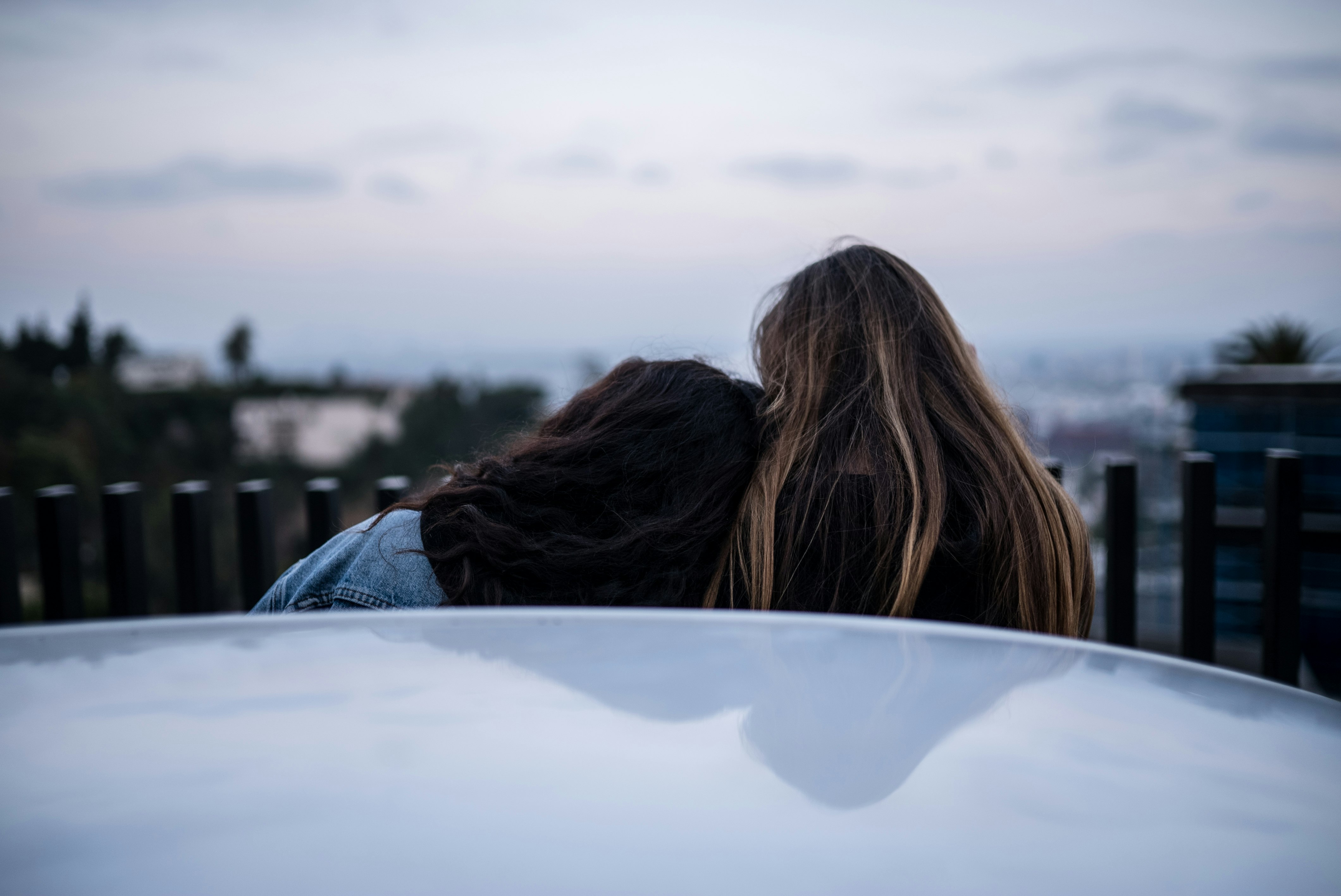 person leaning on person's shoulder